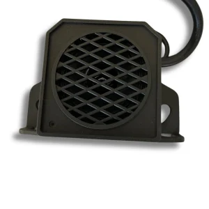 Compact black reversing alarm unit for vans and motorhomes with protective grille and mounting bracket.